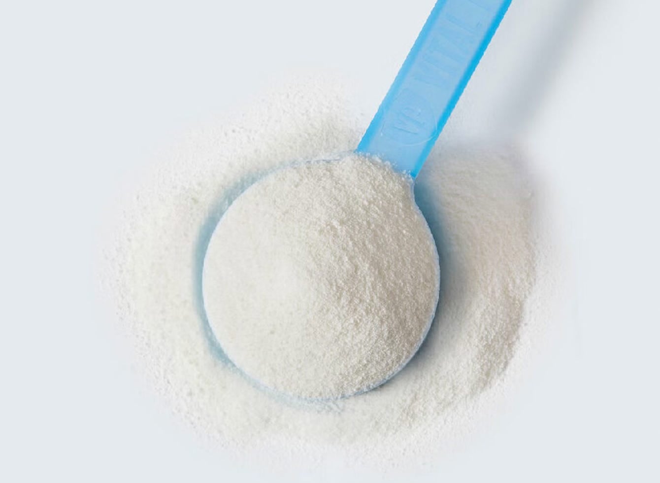 A spoon featuring a generous amount of collagen powder from Vital Proteins brand