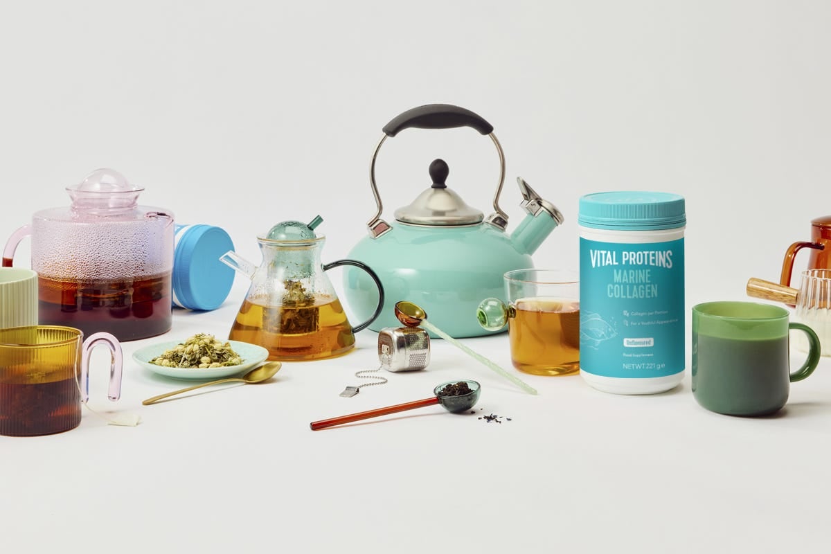 An assortment of teas alongside various tea accessories and collagen powder