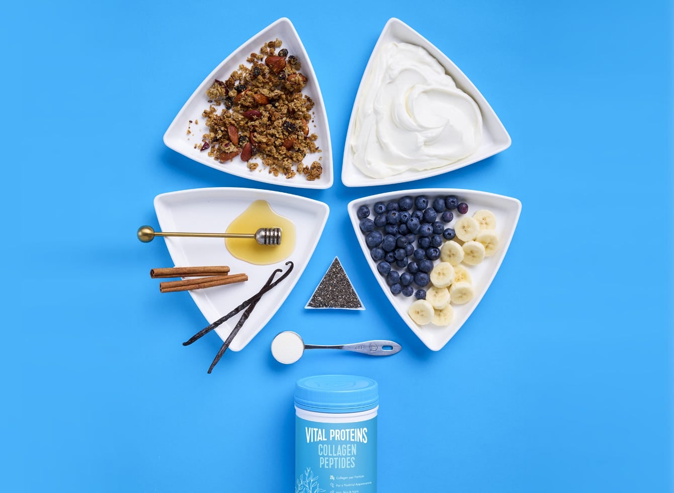 White bowls filled with blueberries and yogurt, highlighting diverse ingredients for collagen intake.