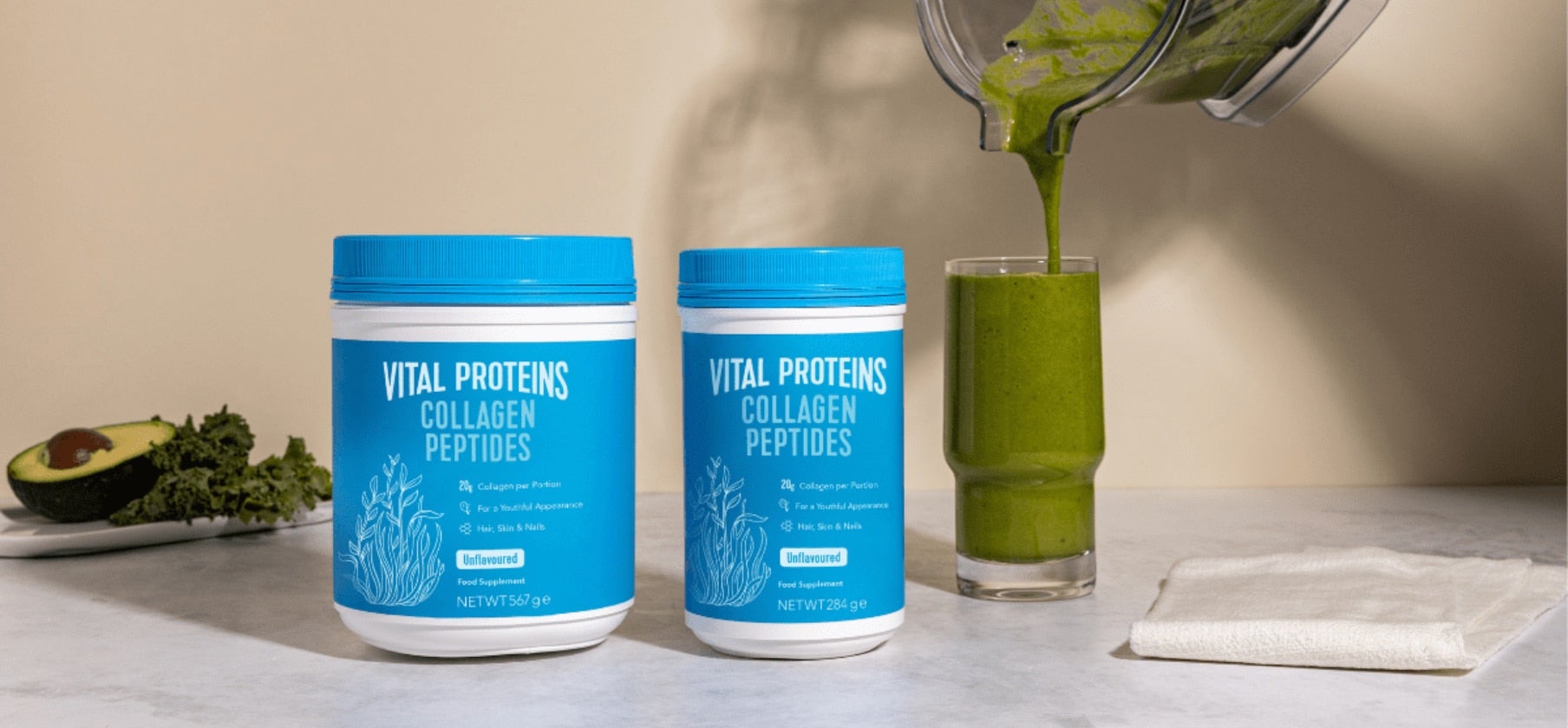A package of collagen peptides rests beside a refreshing smoothie, highlighting health and wellness