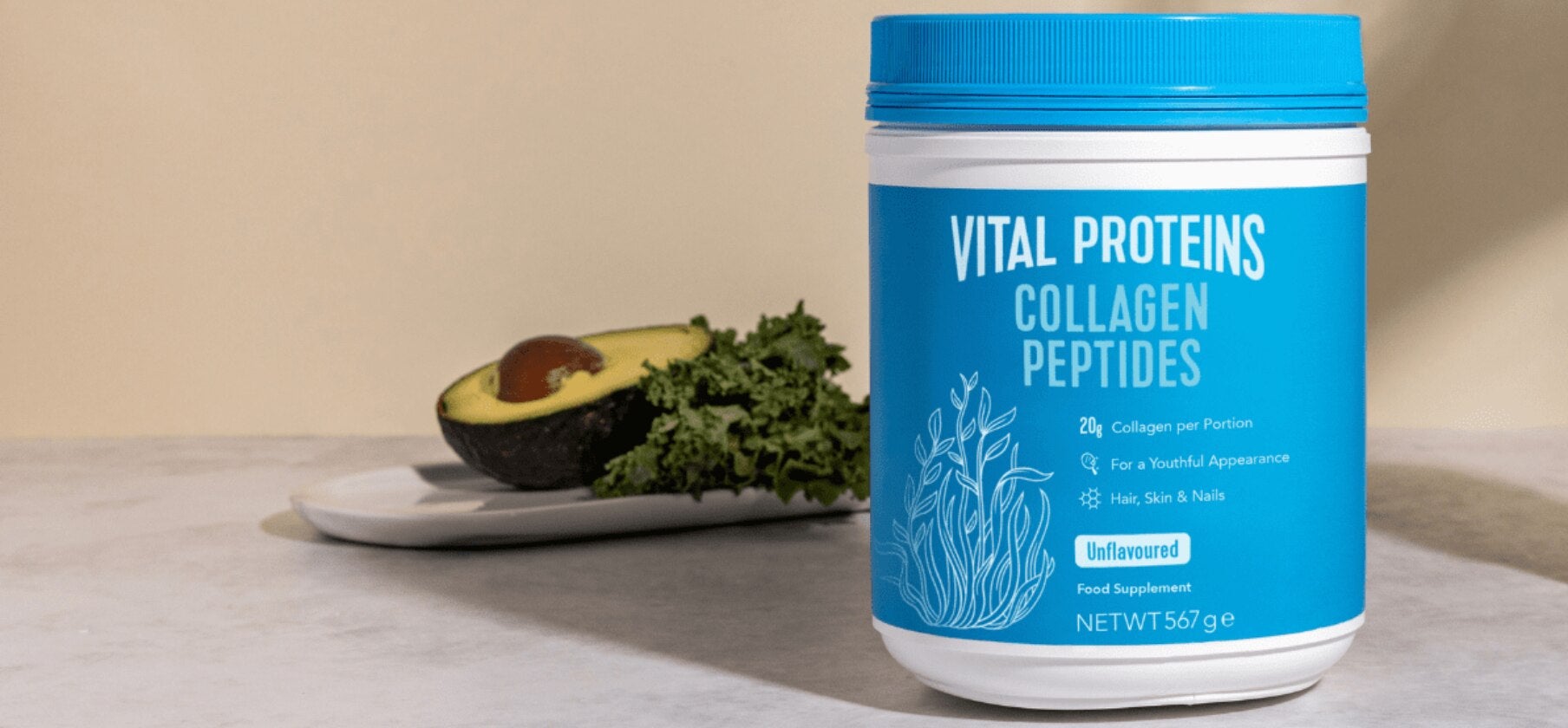 Vital Proteins collagen peptides with avocado and lettuce in background